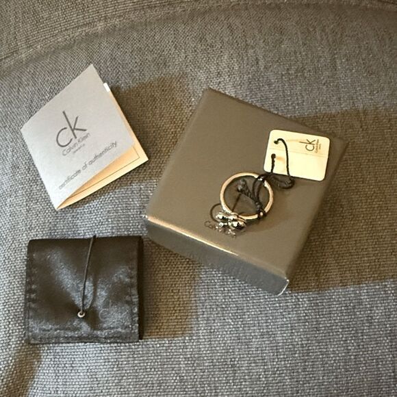 NWT Calvin Klein Women’s Collection Stainless Steel Charm Spin Ring. Size 8. - Picture 3 of 7